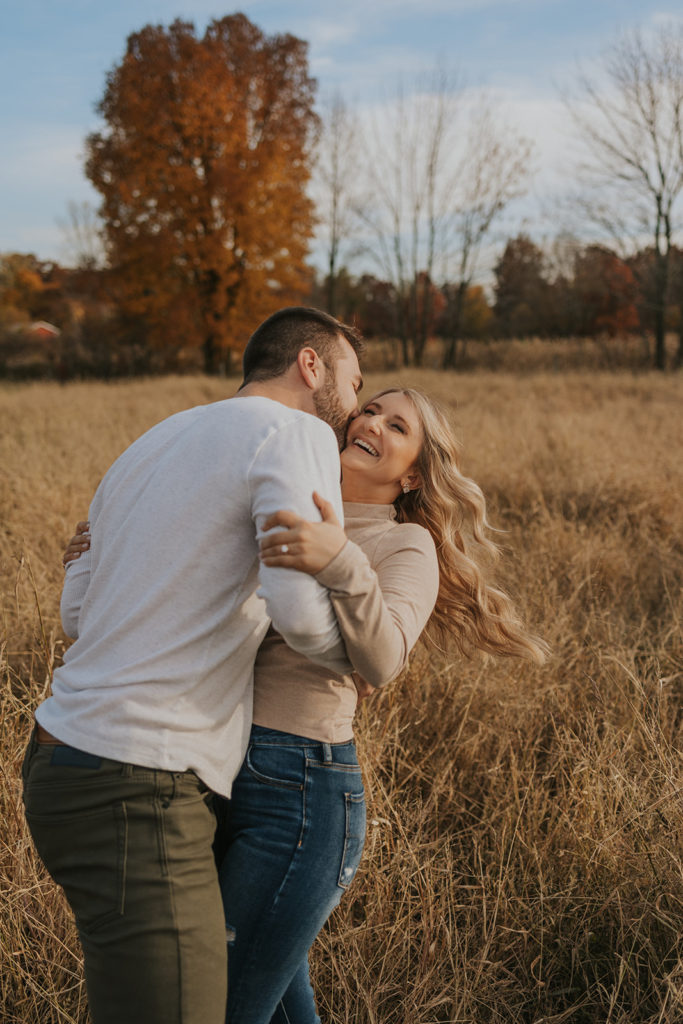 Playful engagement photoshoot in Ohio fields
