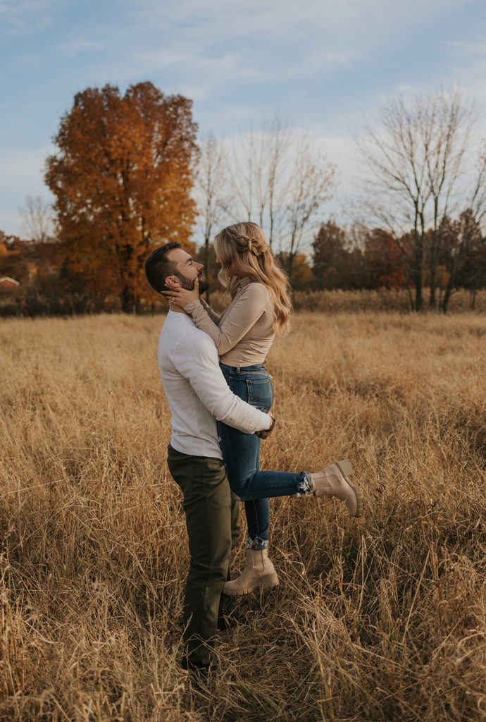 Fall field engagement photos during golden hour