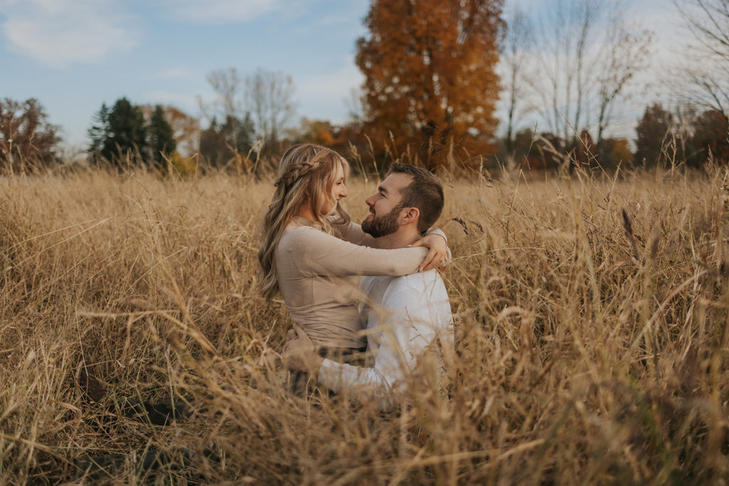 Fall field engagement photos during golden hour