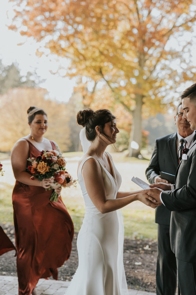 Groom saying vows to bride during wedding ceremony 