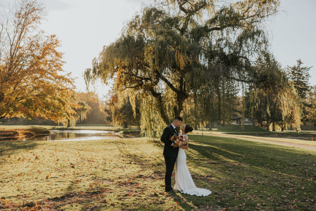 Bride and groom portrait in front of a Willow Tree 