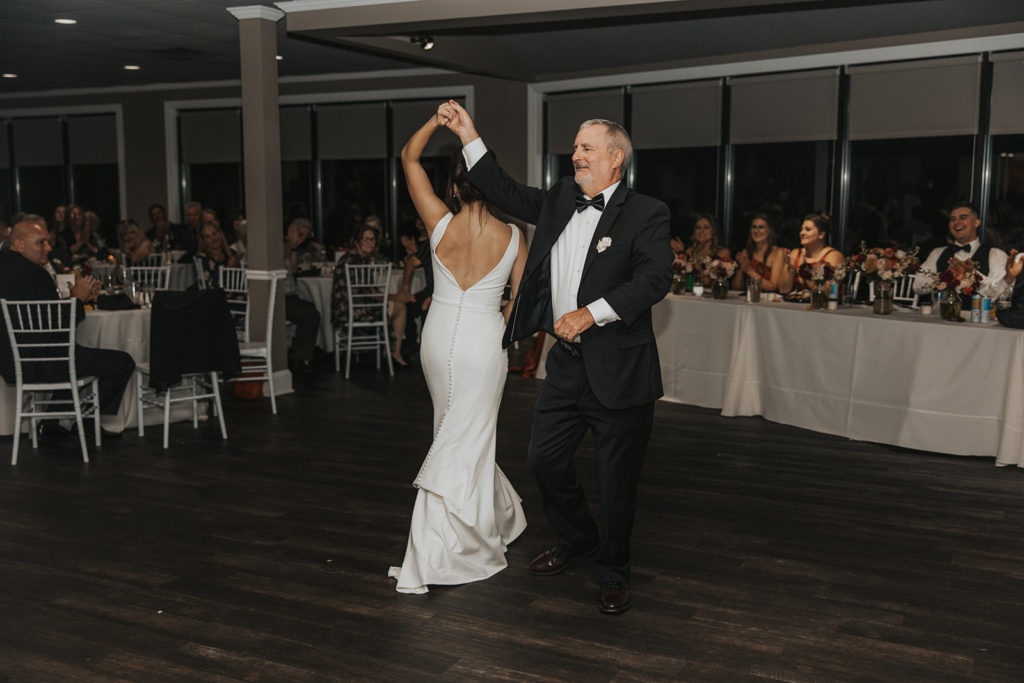 Bride and father of the brides first dance during wedding reception 