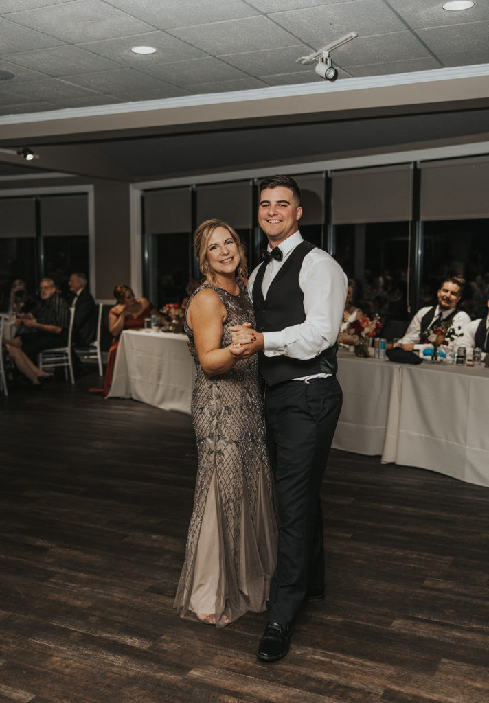 Groom and mother of the grooms first dance at wedding reception 
