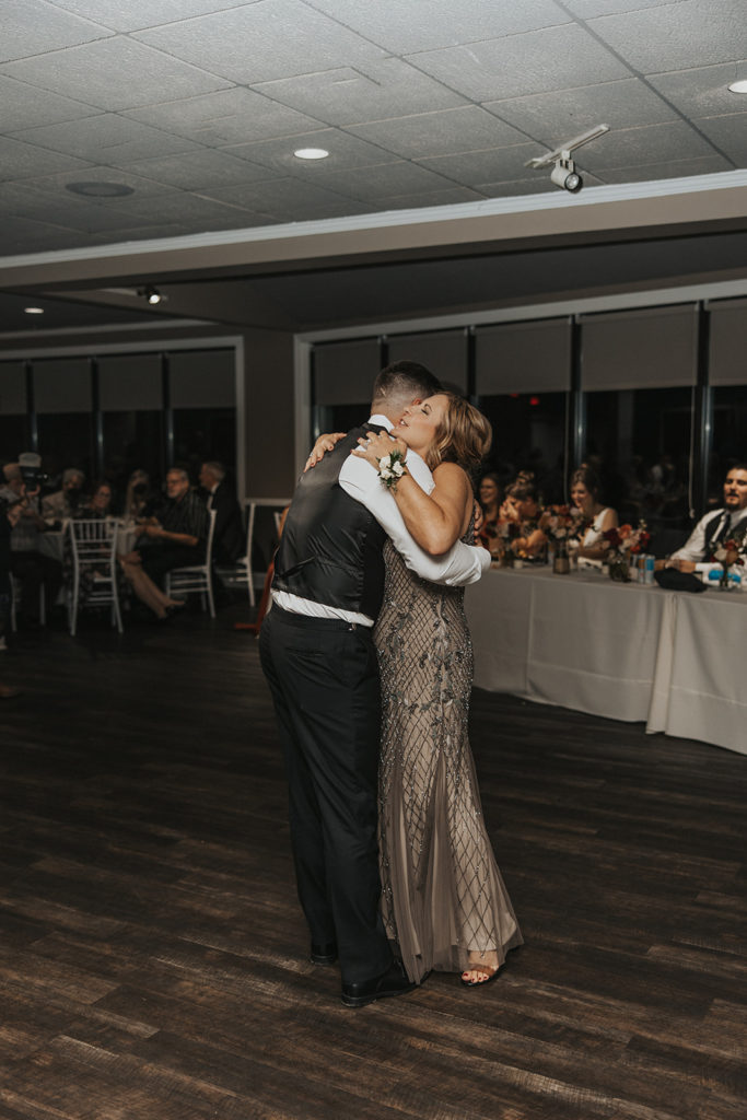 Groom and mother of the grooms first dance at wedding reception 