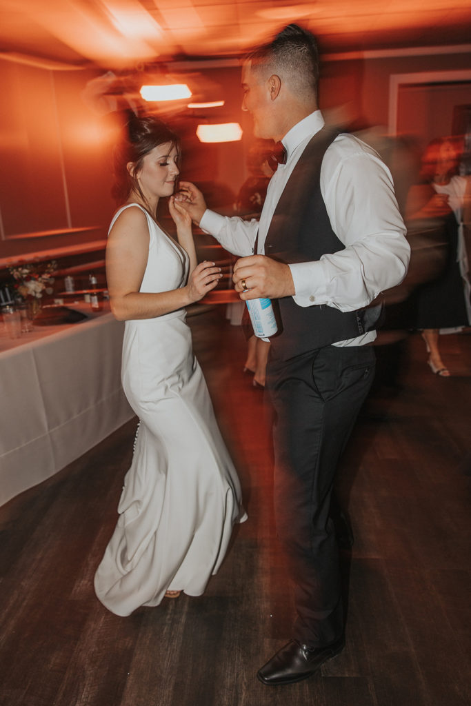 Bride and groom dancing during wedding reception 